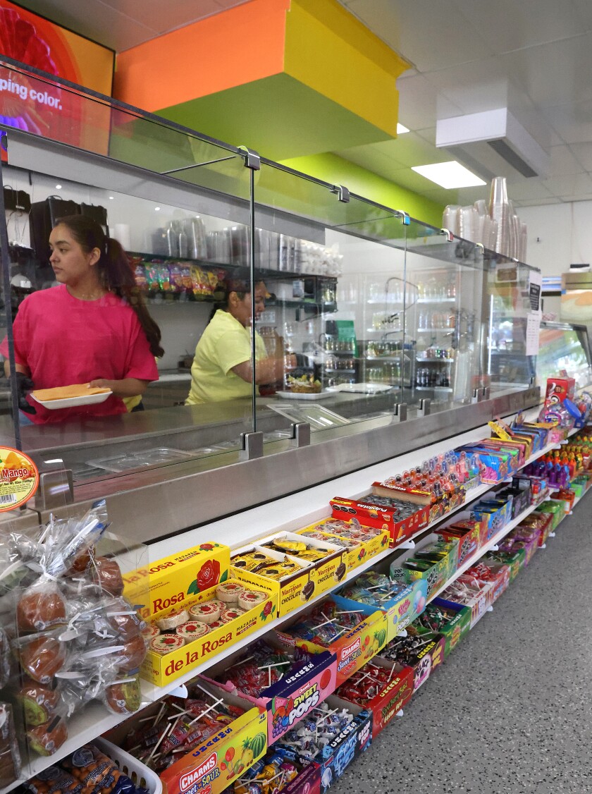 Staff prepare an food orders at the newly opened El Rinconcito in the renovated Thompson building on 10th st. in Worthington Monday afternoon.