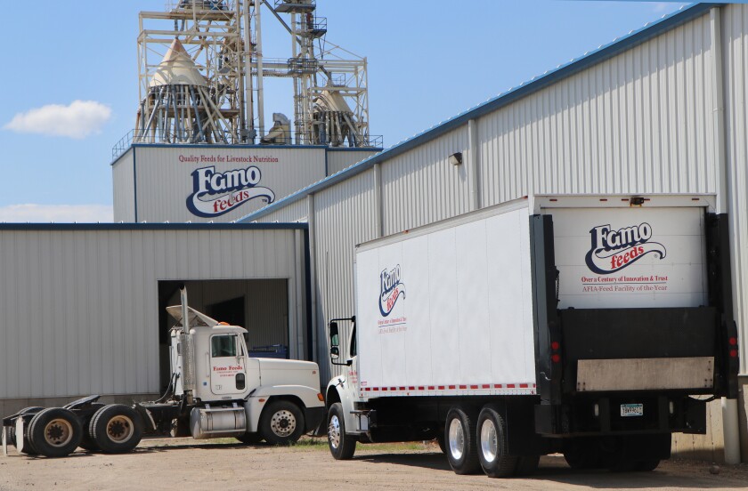 Trucks with Famo Feed logos await shipping duties outside a warehouse near the Famo Feeds headquarters.
