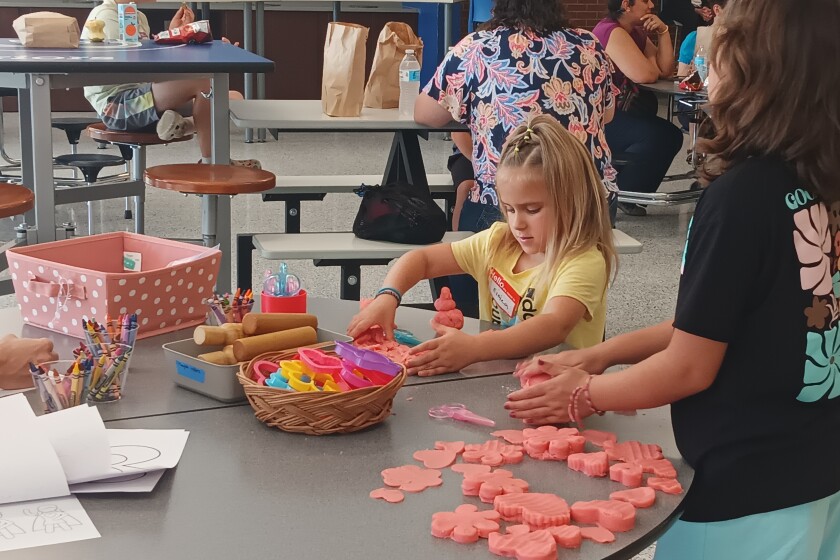 Kids make hearts out of playdough at the third "Grow a Heart" session on Thursday, July 10, 2025.