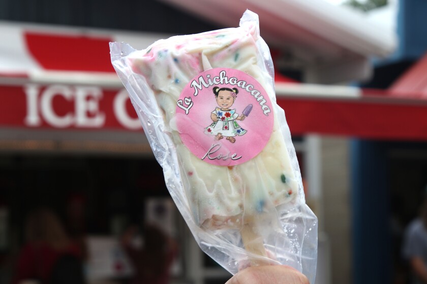 Birthday cake paleta served on a stick.