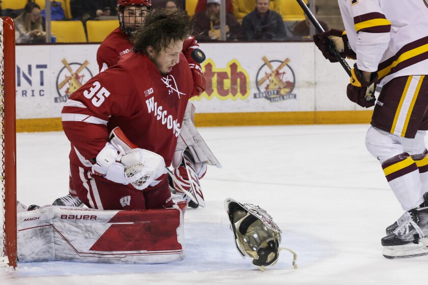 college hockey players play ice hockey