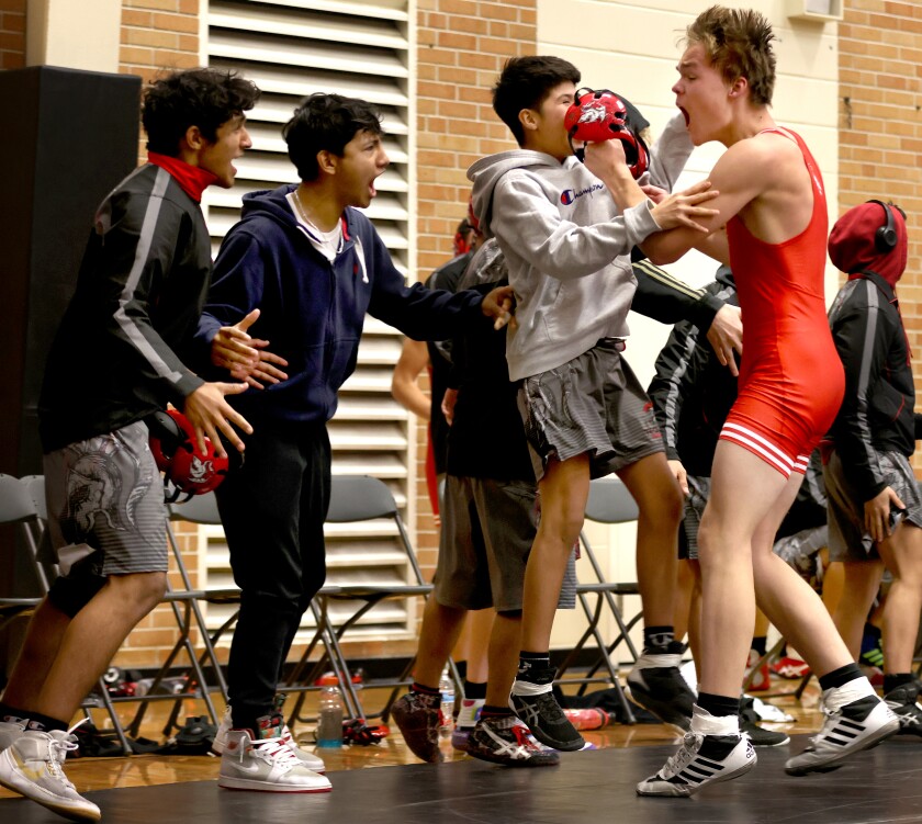 Worthington Trojans Levi Hennings celebrates his win in the 160 weight class against Fairmont/Martin County West wrestler Taylor Austin during a Friday evening Triangular.