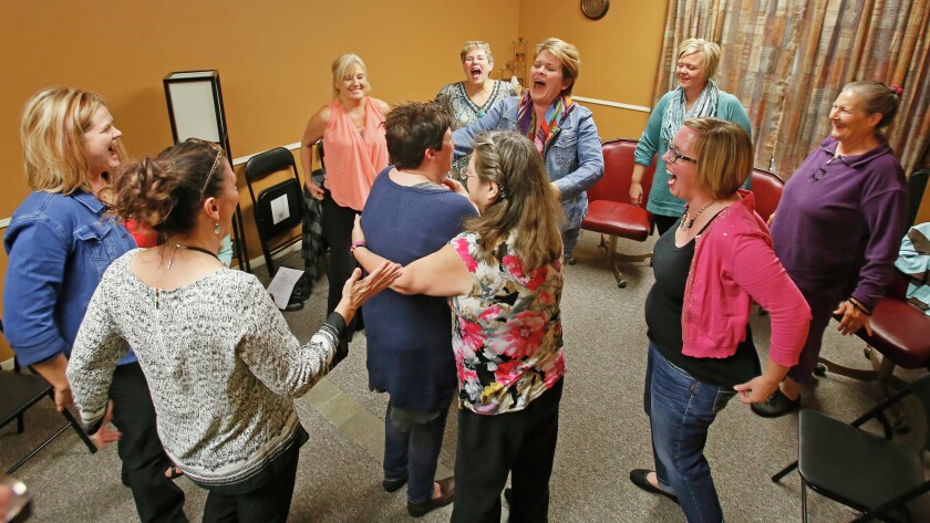 Shauni Hekkanen, second from right, instructs a session in spiritual exercise at the Vision to Reality Initiative in south Fargo.David Samson / The Forum
