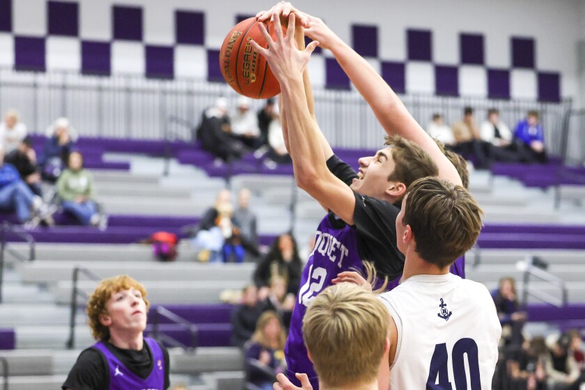 high school boys play basketball