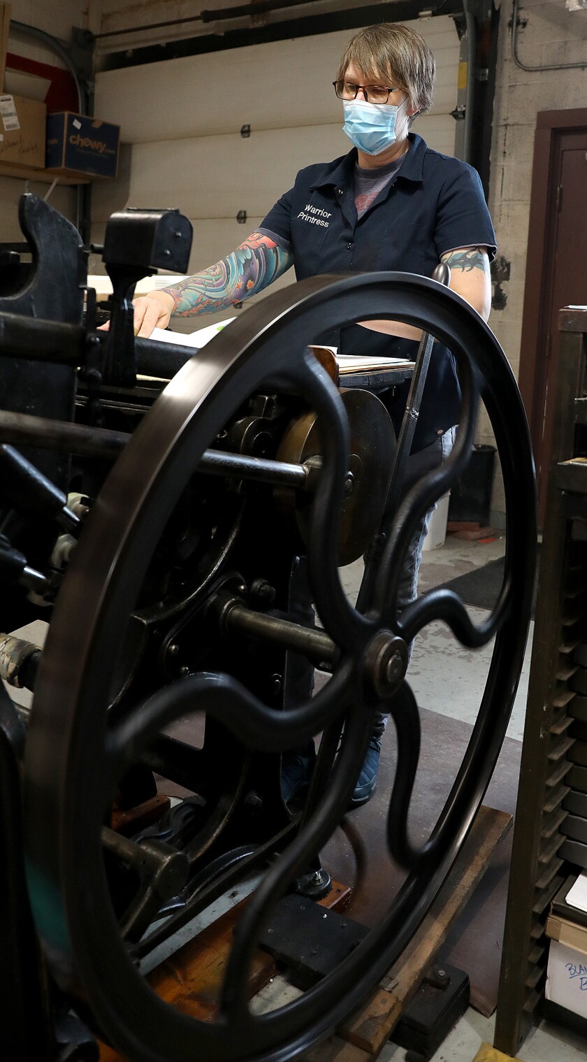 Janelle Miller runs a printing press that is over 100 years old to make cards