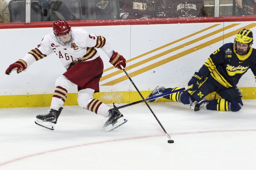 College man playing ice hockey