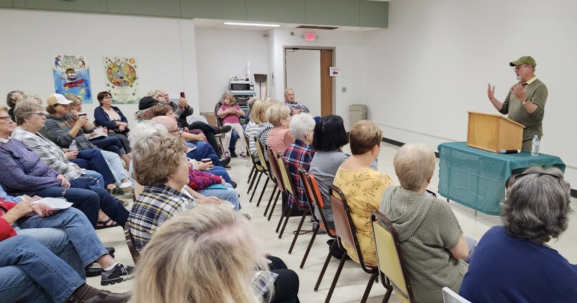 Bestselling mystery-thriller novelist William Kent Krueger speaks about the importance of stories in front of a large crowd at the Worthington branch of the Nobles County Library Saturday, Sept. 24, 2022.