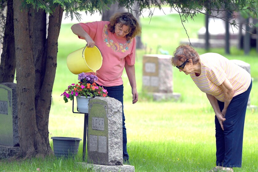 052621.N.BD.Tendingthegraves1.jpg
