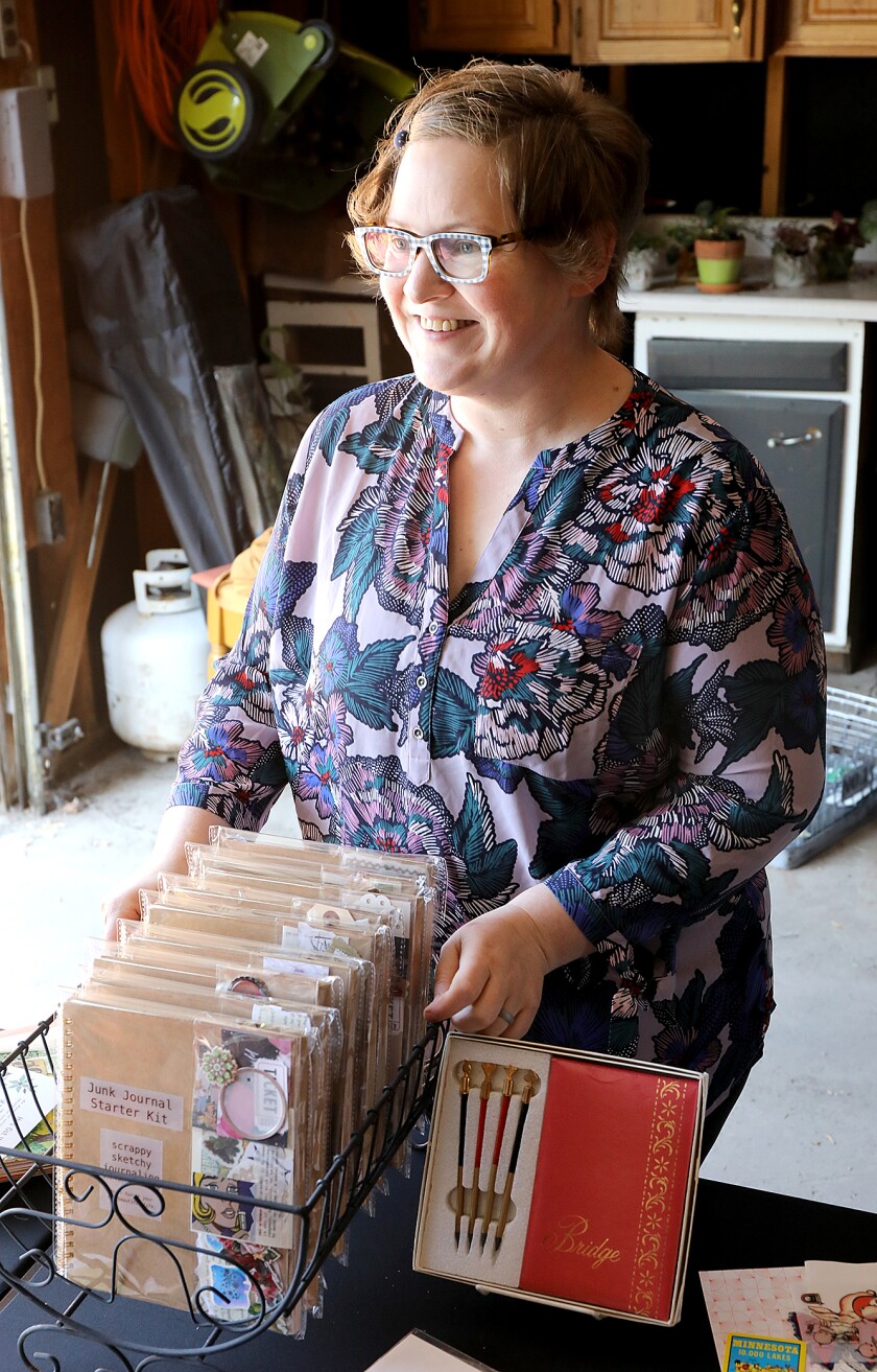 Deb Wilson, of Junk Redeemed, stands by her Junk Journal Starter Kits