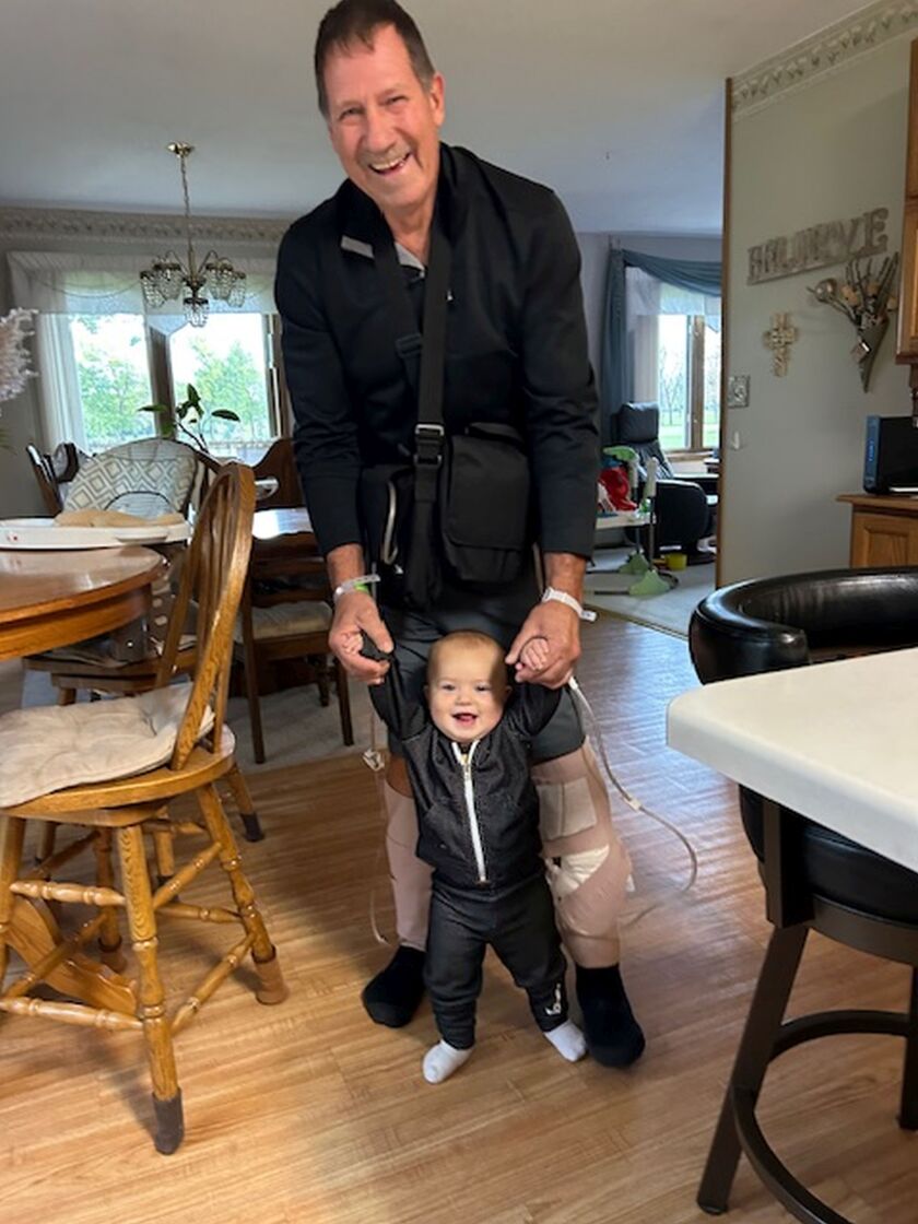 Jawaski_Jim learning to walk with grandson Carsten, age 1, the day after Jim left the hospital, Oct. 13, 2023, at their temporary home (they are awaiting the finish of their new home).jpg