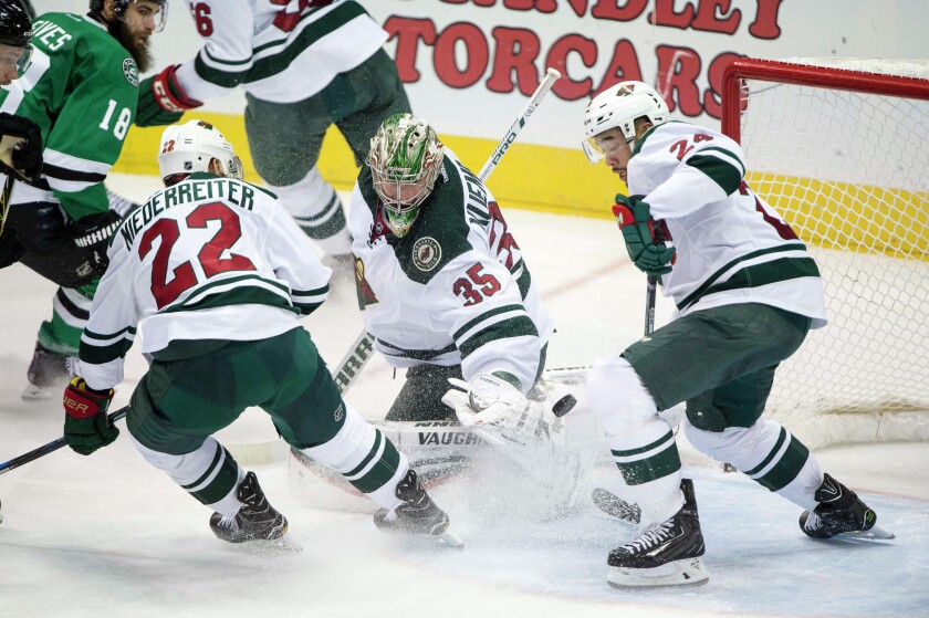 Minnesota Wild right wing Nino Niederreiter (22) and goalie Darcy Kuemper (35) and defenseman Matt Dumba (24) face the Dallas Stars attack during the second period at the American Airlines Center. Photo by Jerome Miron-USA TODAY Sports