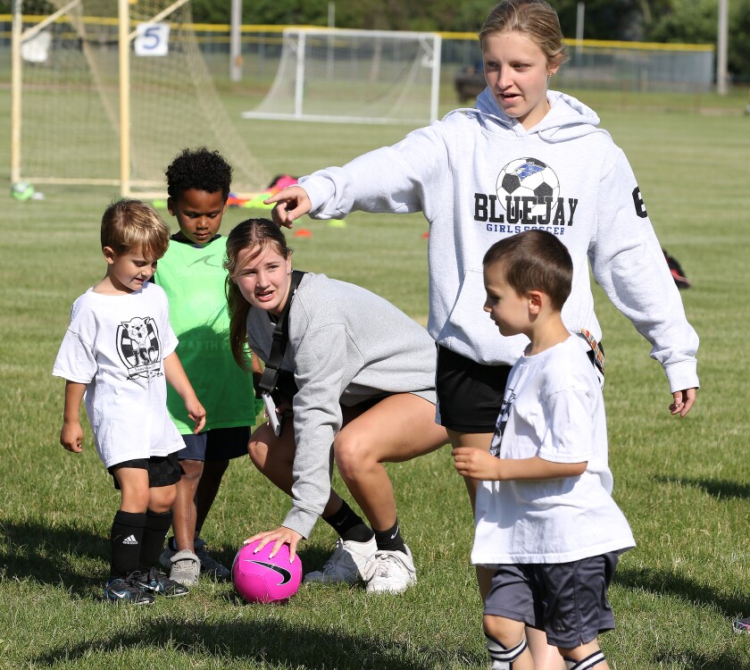 jhs football player coach two 061622.jpg