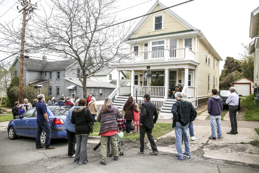 People gather for the celebration for Bob Dylan's 76th birthday at his childhood home in Duluth Wednesday afternoon. (Clint Austin / caustin@duluthnews.com)