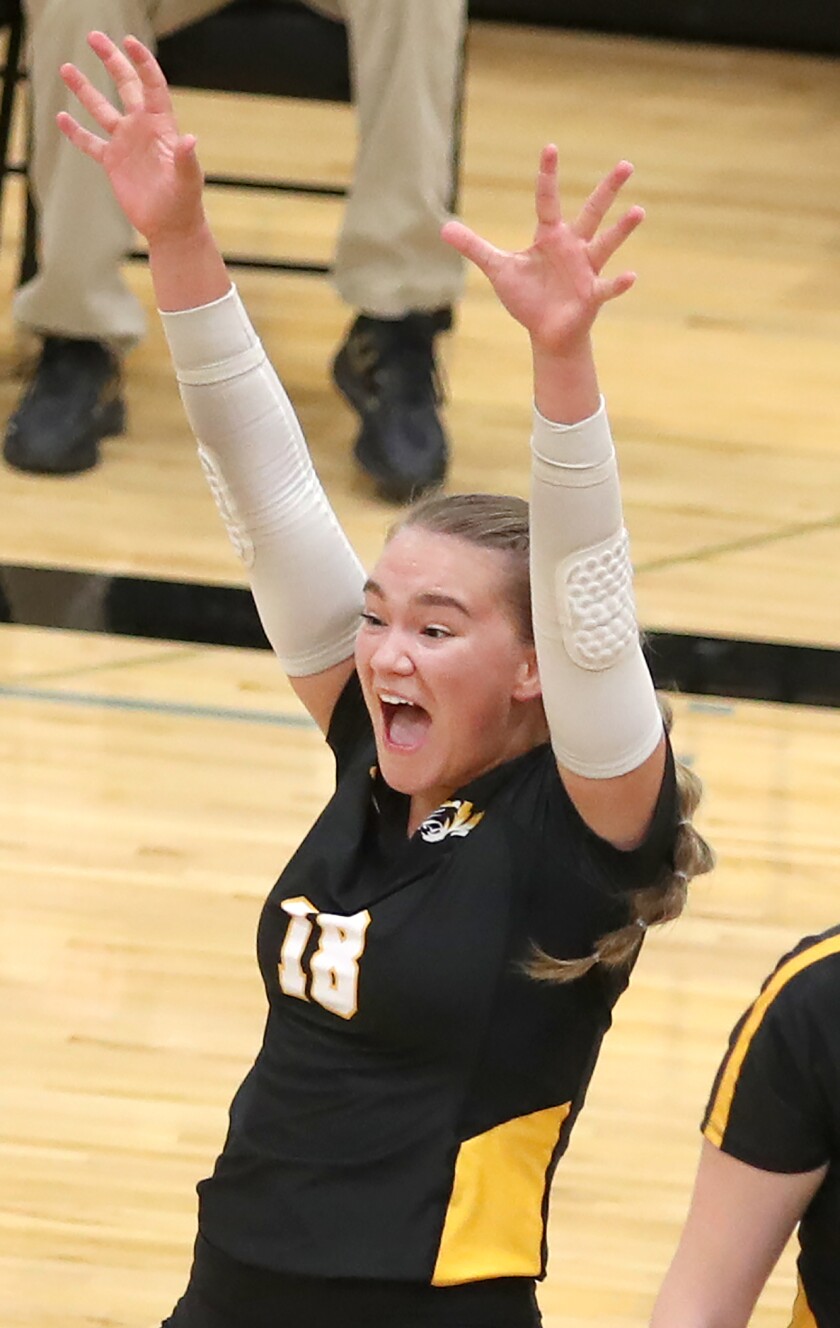 Northwestern’s Kayla Paulsen (18) celebrates a kill during the Tigers match with Rice Lake