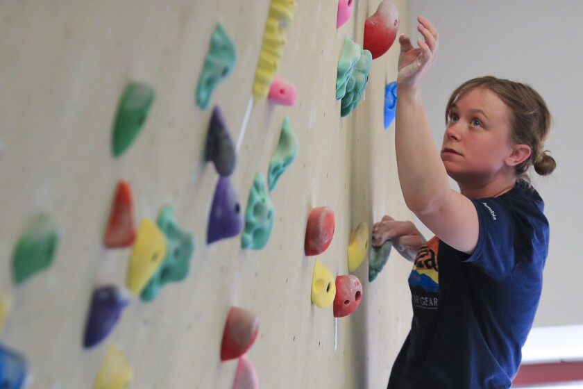 People using indoor climbing wall