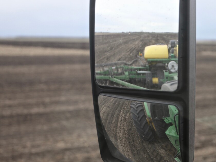 A look through the sideview mirror while planting corn on Wednesday, May 5.jpg