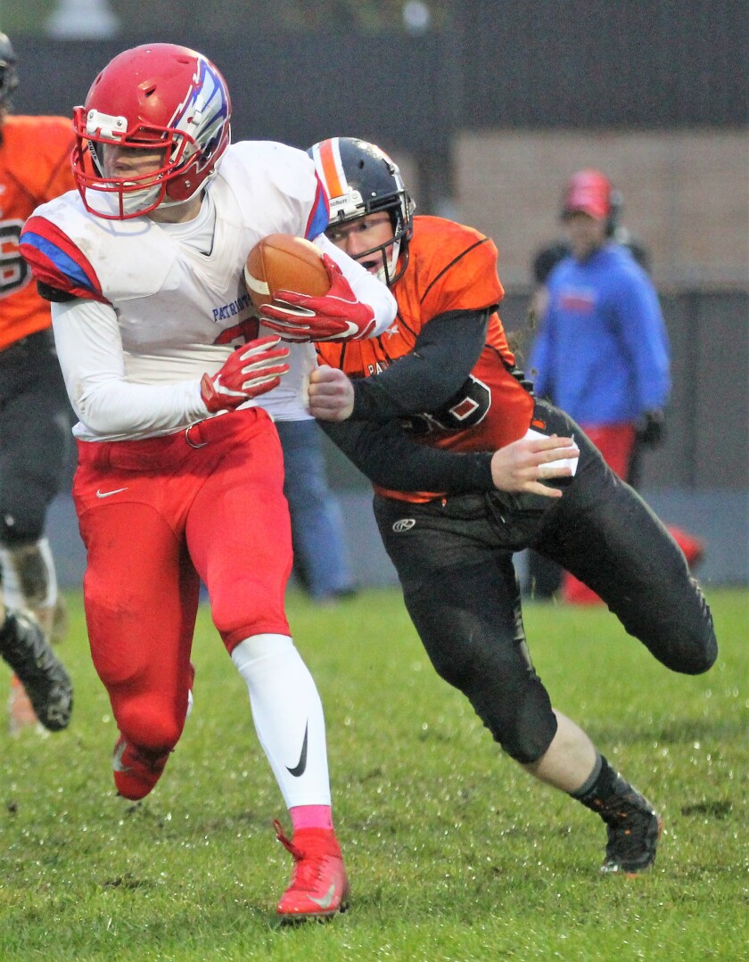 Pequot running back Zach Jorgens tries to shake off a tackle by Park Rapids' Jack Hensel on Friday, Oct. 5.