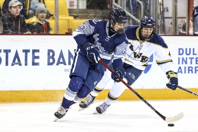 high school boys play ice hockey