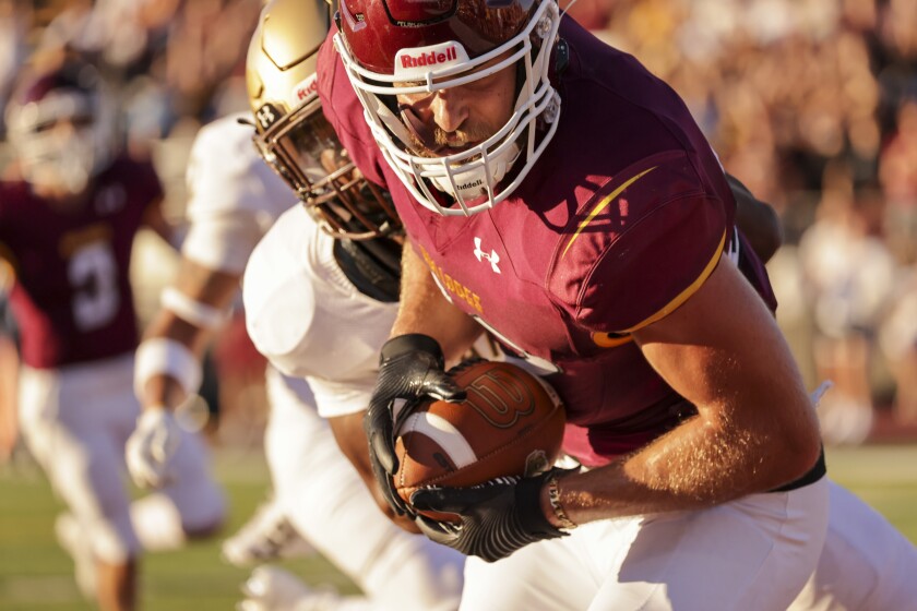 Football player playing in outdoor stadium