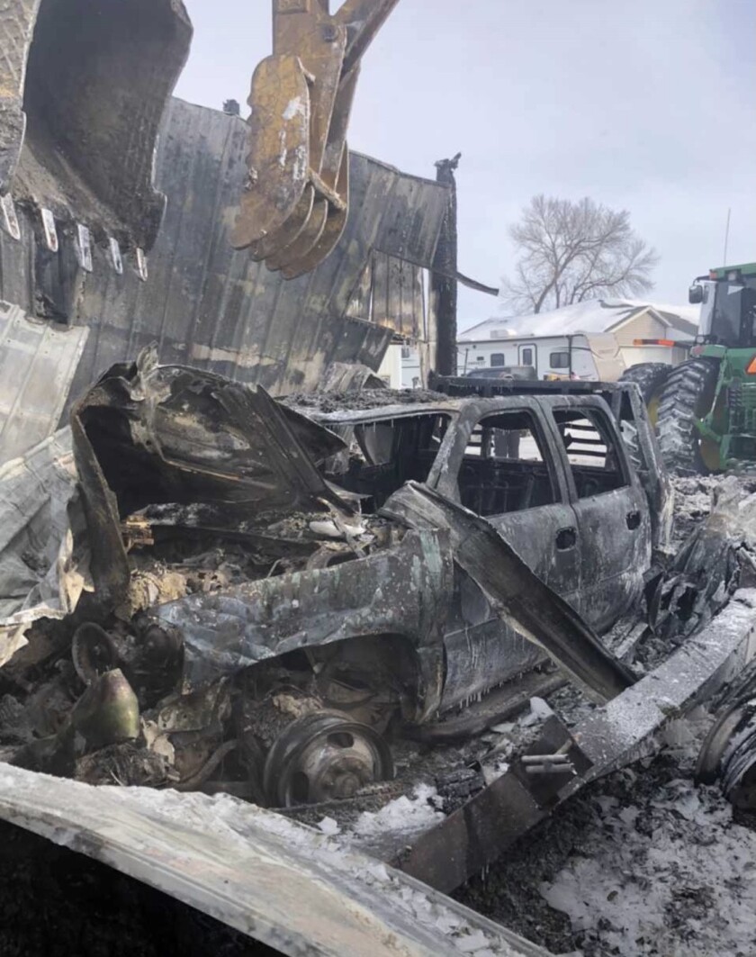 A burned pickup truck at the site of a Brooten, Minnesota, fire.