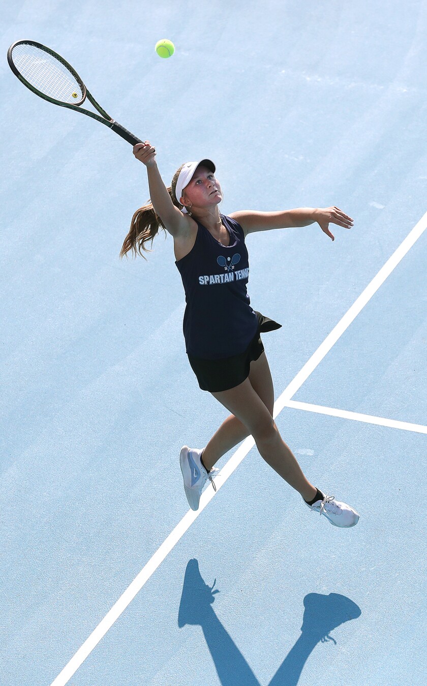 Superior’s Sydney Friedrich leaps to get to a ball during her match at one singles