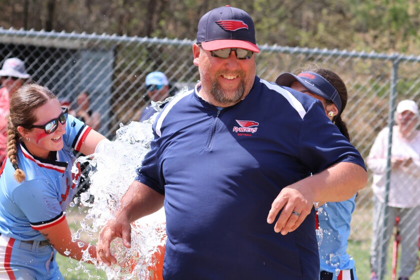 Ray Austin, the coach of the Central Lakes College, receives ice water over him, after Raiders defeated Minnesota West on Friday, May 9, 2025, in Brainerd.