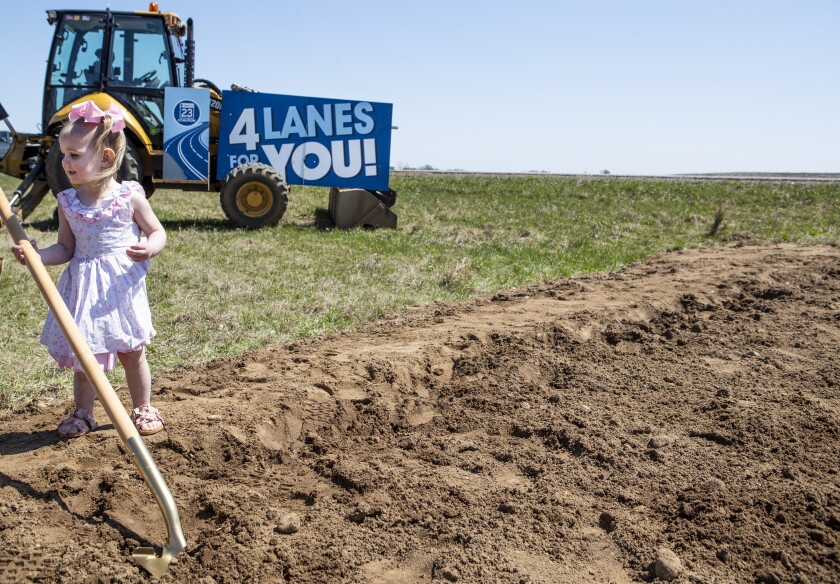 Eleanor Braun, 1, holds a golden shovel during the Minnesota Highway 23 The Gaps Groundbreaking Ceremony Friday, May 6, 2022, in Roscoe.