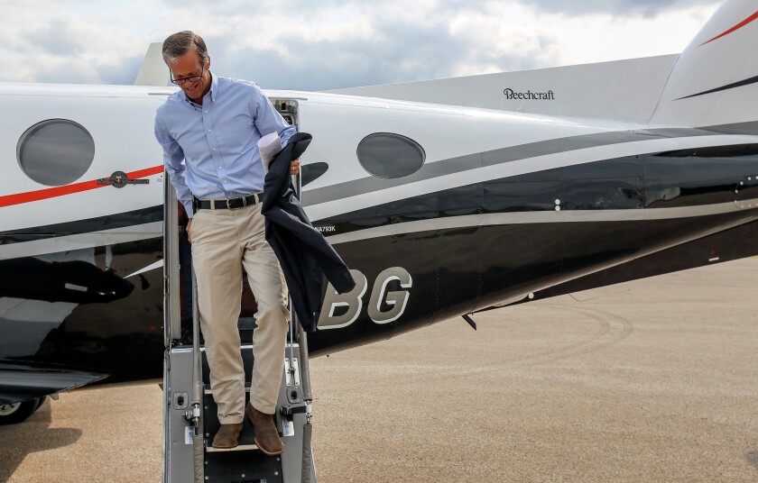 U.S. Sen. John Thune, R-S.D., climbs off a chartered plane in Buffalo on Aug. 17. (Marcus Traxler/Republic)