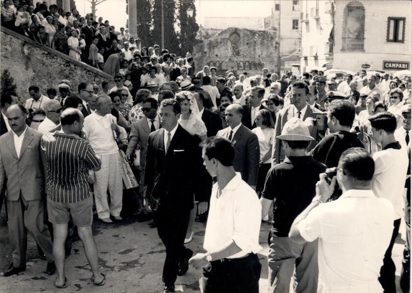100 1962_Ravello_Clint leads JBK through Ravello from church.jpeg