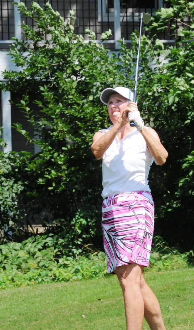 Molly Baker follows through on her tee shot at the par 3 7th hol