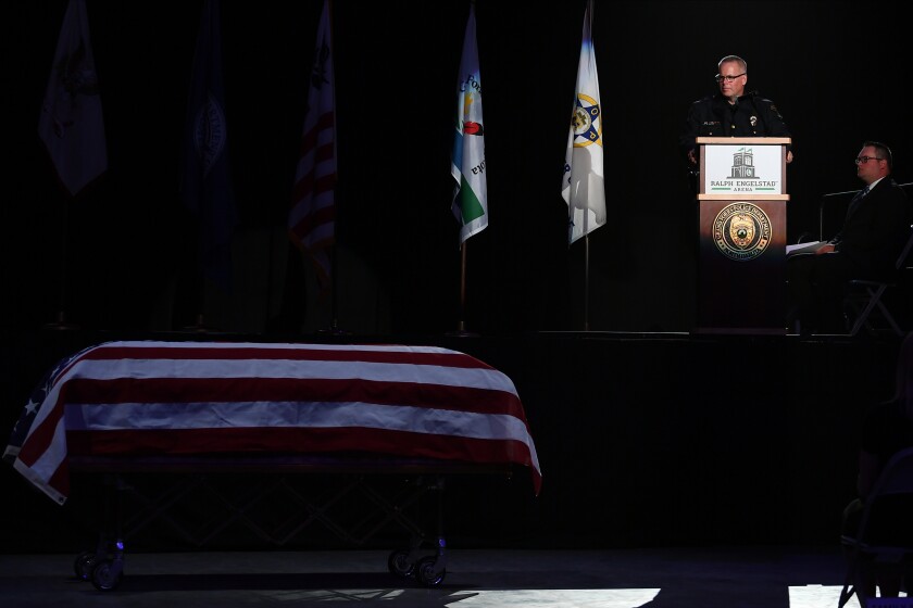 Nelson looking at casket.jpg
