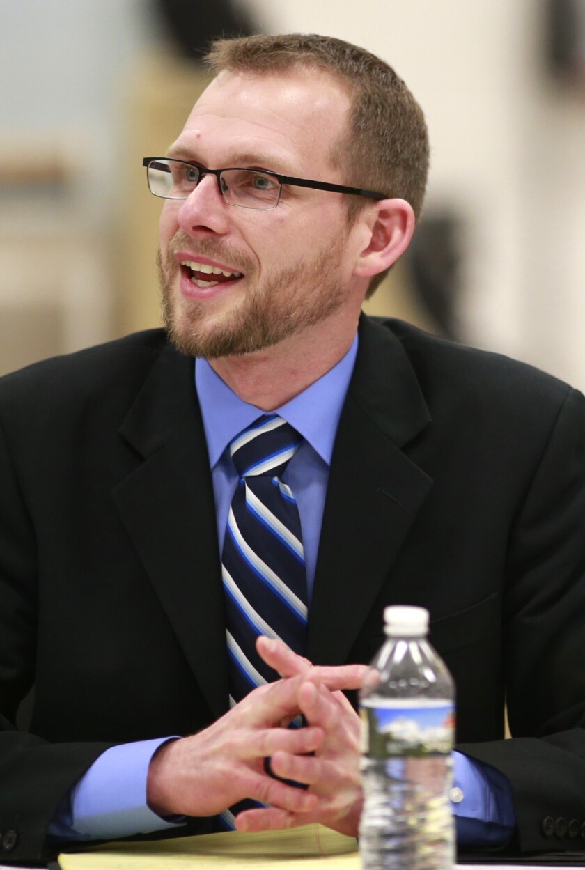 Jeremy Olson answers questions from the Crookston School Board on Wednesday during a second interview for the job of superintendent of Crookston Public Schools. (Photo by Eric Hylden/Grand Forks Herald)
