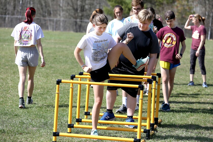 Northwood/Solon Springs’ Aubrey Guttormson goes over a hurdle as the team warms up