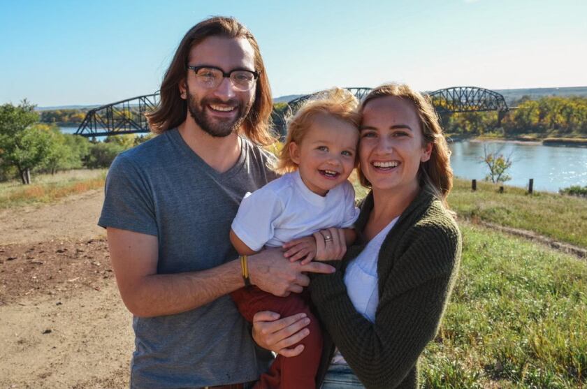 Kari Schaaf, pictured here in front of the Missouri River in Bismarck with her husband, Danny, and their son, Blixen, will temporarily relocate to Seattle for Kari's first assignment as a travel nurse.