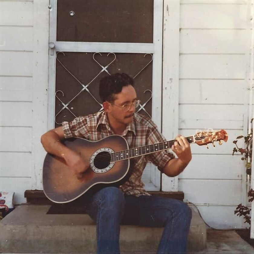 Sgt. Stephen Kenneth Nicklay playing a guitar when younger.jpg
