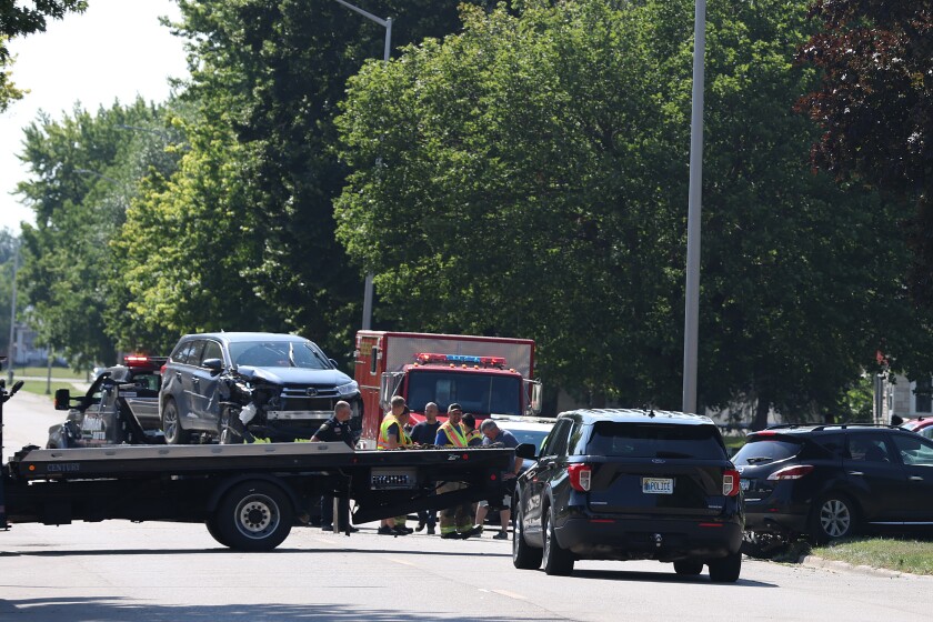 Tow trucks load damaged vehicles onto flatbeds after the Worthington Fire, Police and Ambulance were called to a crash at the intersection of Diagonal Road and Thomas Avenue Wednesday morning.