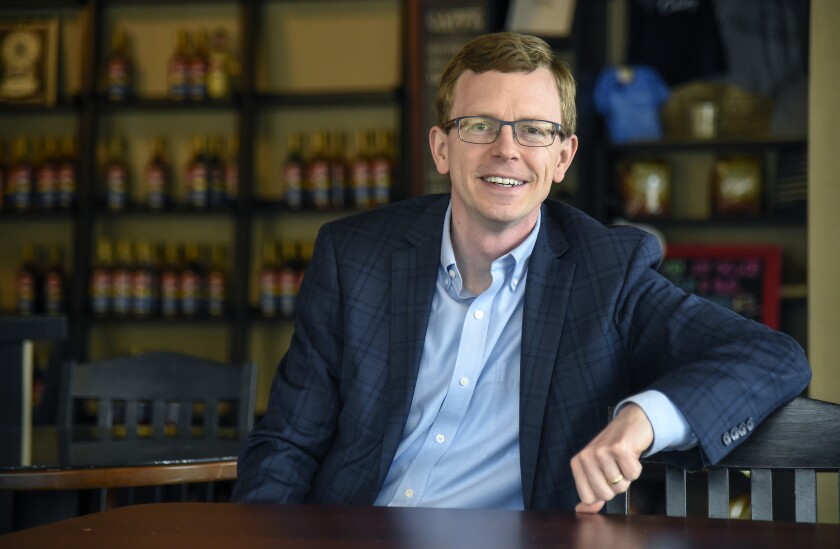 Mitchell resident and U.S. Congressional Representative candidate Dusty Johnson sits for a photo inside Cornerstone Coffee House and Deli. (Matt Gade / Republic)