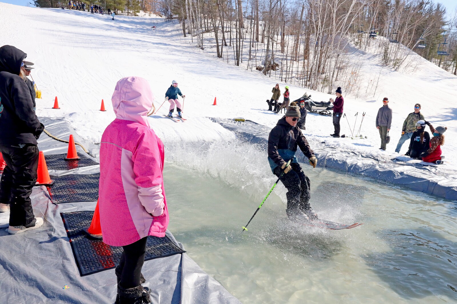 Skiers and snowboarders participate in the water skip at Mount Ski Gull on Saturday, April 8, 2023, for the end of the season.