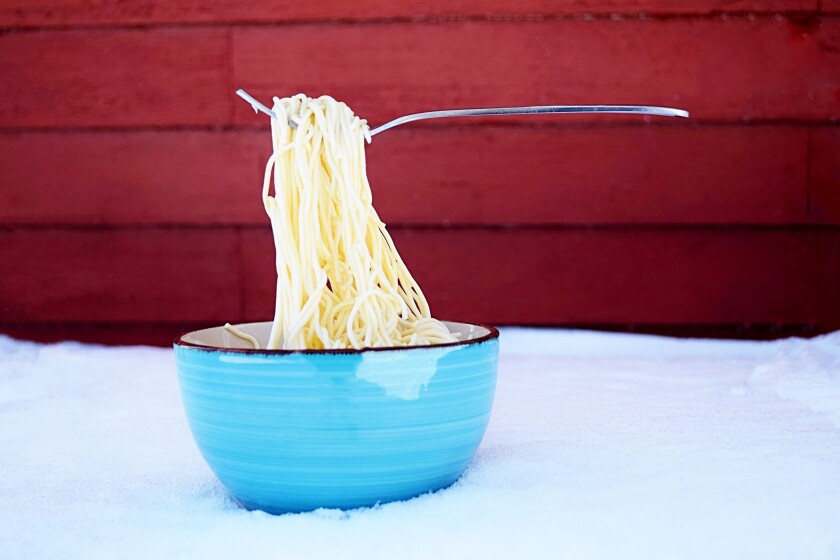Frozen noodles with a fork