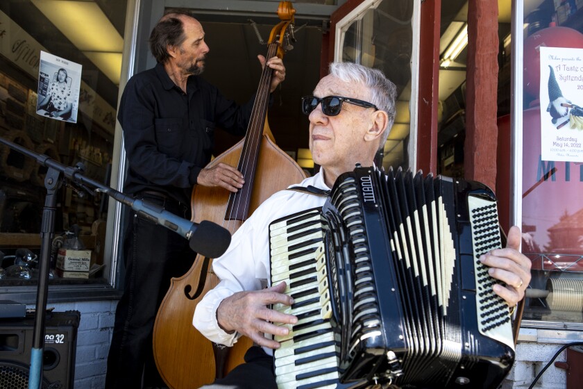 Arnie Anderson, right, and guest player Richard Handeen perform with "Skólmusik" on the sidewalk of Main Street in downtown Milan during the 16th annual "A Taste of Syttende Mai," Saturday, May 14, 2022.