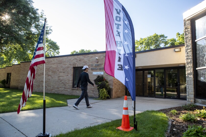 Voter Carter Greiner walks into the Church of St. Mary polling location in Willmar to vote on Tuesday, August 9, 2022.