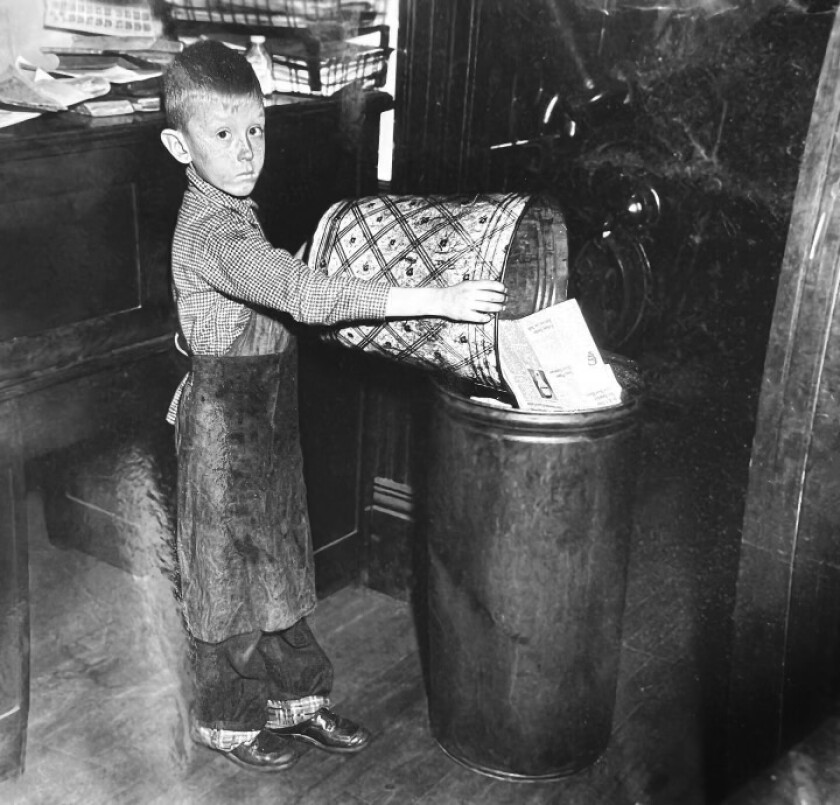 Michael Parta as a child working in the New York Mills Herald.jpeg