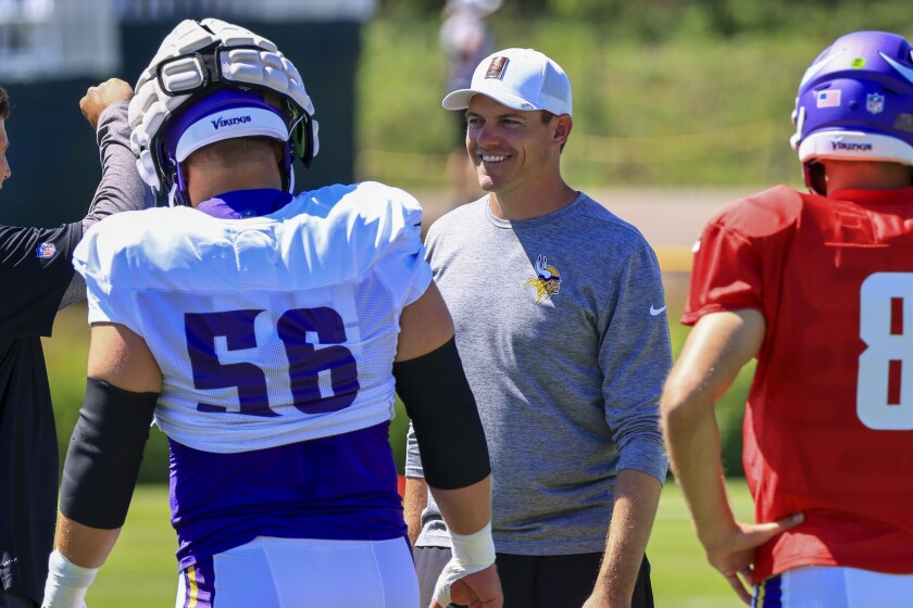 Professional football players practice at outdoor field