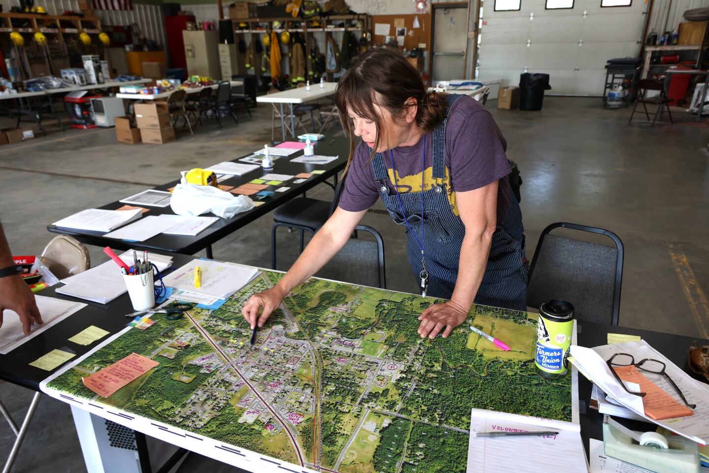 Woman points to map of Cook