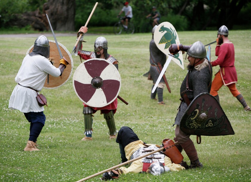 Modern Vikings perform mock combat during the 2016 Scandinavian Hjemkomst and Midwest Viking Festival 2016. Forum file photo