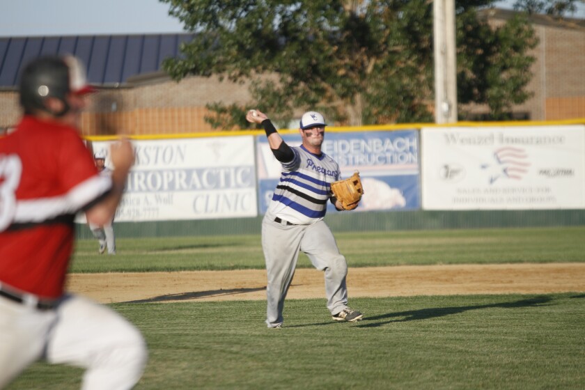 Winner/Colome third baseman Austin Richey throws to first base to throw out a Parkston Mudcats runner during the District 5B amateur tournament in Parkston on Sunday. (Ryan Deal/Republic)