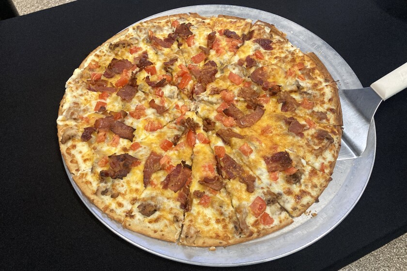 Pizza displayed on a pan.