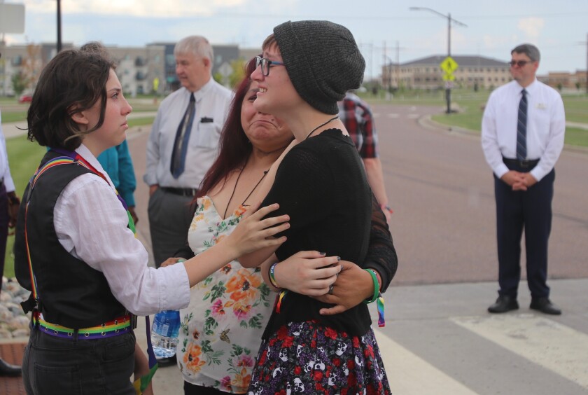 Phoenix Paulsen being comforted by friends and family after a public service was held for her sister Daisy 'Jupiter' Paulsen on Sunday, June 27, 2021.jpg