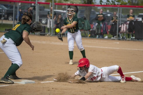 Willmar freshman Hannah Magnuson slides back to third base while taking on Sauk Rapids at home during a Section 8AAA playoff game in Willmar on Tuesday, May 24, 2022.