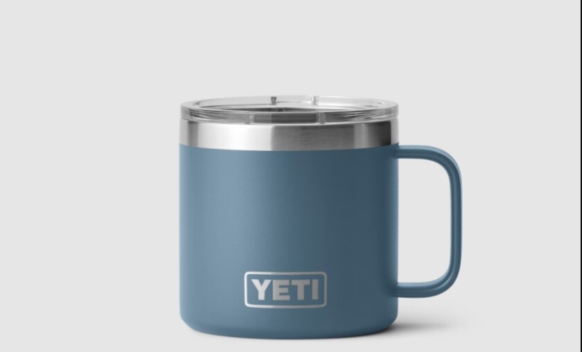 A blue mug with the word "YETI" on it.